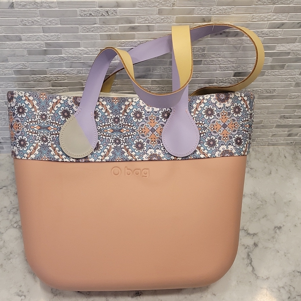 Pink O bag with patterned edging.